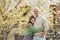 Teenage daughter hugging her father outside in town when spenidng time together.