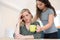 Teenage Daughter Making Drink For Parent Suffering With Mental H