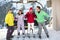 Teenage Family Getting Off Chair Lift On Holiday