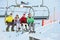 Teenage Family Getting Off Chair Lift On Holiday