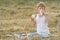 Teenage farmer boy tasting fresh milk and bread