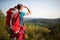 Teenage female hiker watching in distance