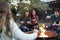 Teenage friends making sï¿½mores with toasted marshmallows