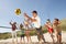 Teenage Friends Playing Volleyball On Beach