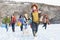 Teenage Friends Sledging In Snowy Landscape