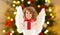 Teenage girl with angel wings and christmas gift