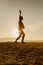 Teenage girl balancing on slackline silhouette