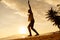 Teenage girl balancing on slackline silhouette on the beach