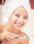 Teenage girl in the bathroom with toothbrush. Dental hygiene