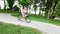 Teenage girl on a bicycle going down a hill