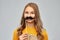 Teenage girl with black moustaches party accessory