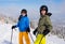 Teenage girl and boy skiing