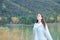 Teenage girl breathing fresh air on a lake in winter