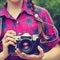 Teenage girl with a camera. old photo camera. youth lifestyle.