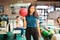 Teenage Girl Carrying Red Bowling Ball In Club