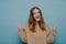 Teenage girl celebrating victory or success isolated on blue background