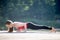 Teenage girl in chaturanga dandasana pose