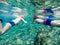 Teenage Girl and Child Snorkeling and Swimming Underwater