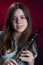 Teenage Girl Clarinet Player on Red