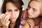 Teenage girl comforting tearful friend