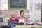 Teenage Girl Displaying Pastry In Shop