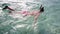 Teenage girl diving in shallow water with mask and snorkel