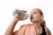 Teenage girl drinking water from bottle after Trening