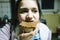 teenage girl eats slice of bread with chocolate cream and hazelnuts for snack close up view