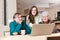 Teenage girl with grandparents using laptop