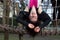 Teenage Girl Hanging Upside Down on Jungle Gym