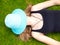 Teenage Girl with a hat covering her face lying on her back