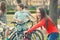 Teenage girl having fun on bicycles with her friends in spring park