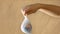 A teenage girl holds a plastic bag in her hand that contains a mini globe, recycled paper background, footage suitable