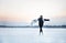 Teenage girl ice skating on a frozen lake. Winter, cold weather