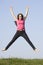 Teenage Girl Jumping in Summer Meadow