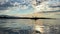 Teenage girl is kayaking at sunset in Pacific Ocean, only the silhouette of Kayak Paddles is visible she swims along