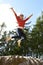 Teenage Girl Leaping In Air Outdoors