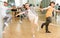 Teenage girl learning to dance lindy hop in pair in choreography class