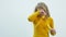 Teenage girl lets out soap bubbles. White background