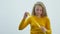 Teenage girl lets out soap bubbles. White background