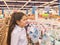 A teenage girl looks at a showcase with shoes