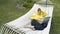 Teenage girl lying in a hammock with laptop in summer