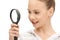 Teenage girl with magnifying glass