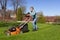 Teenage girl mowing grass