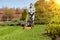 Teenage girl mowing grass