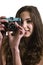 Teenage girl with plastic camera
