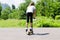 Teenage girl playing on a scooter