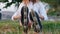 A teenage girl putting on her roller-skates and stand up