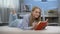 Teenage girl reading book, dreaming of romantic love, imagining heroic man