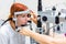 Teenage girl with red hair gets laser eye coagulation